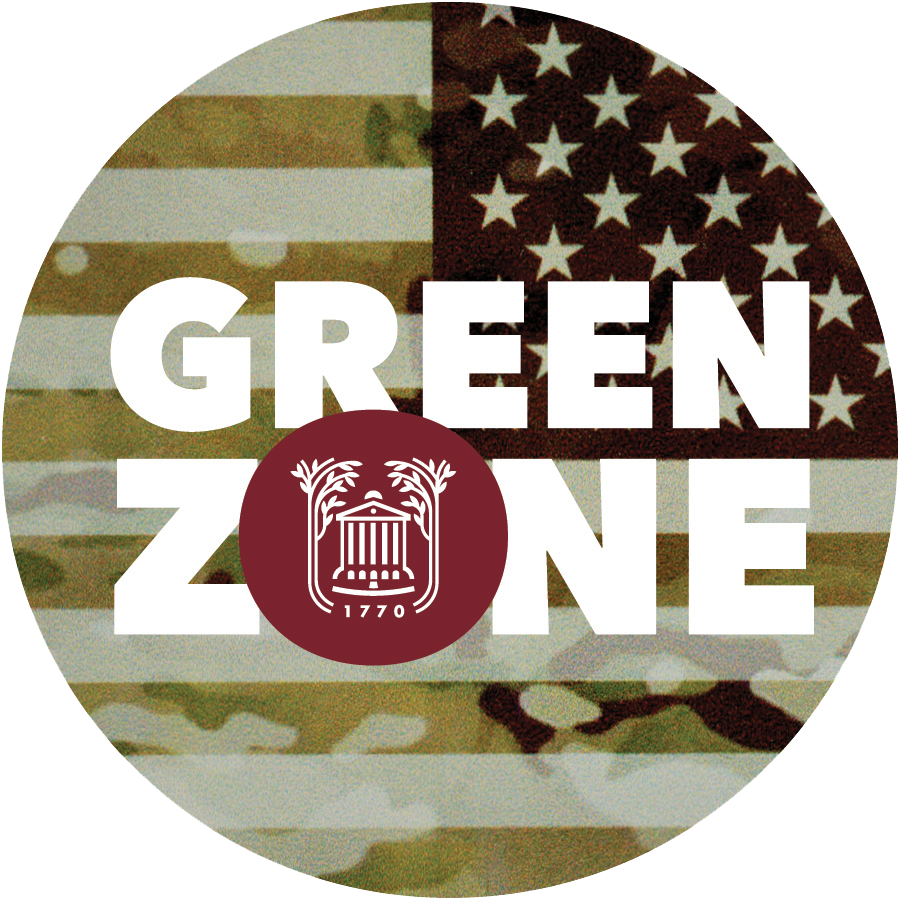 Round icon with the words "Green Zone" across a backwards USA flag. The flag has a green tint and camouflage pattern over it. The "O" in "Zone" has the College's logo in it.  
